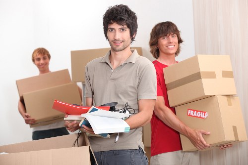 A compact removal team loading items for a short-distance move